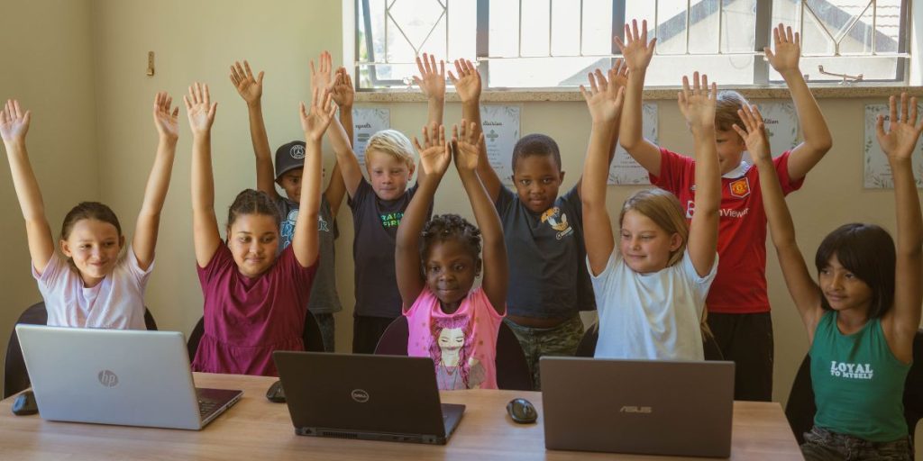 Children holding their arms up to show that they are accountable