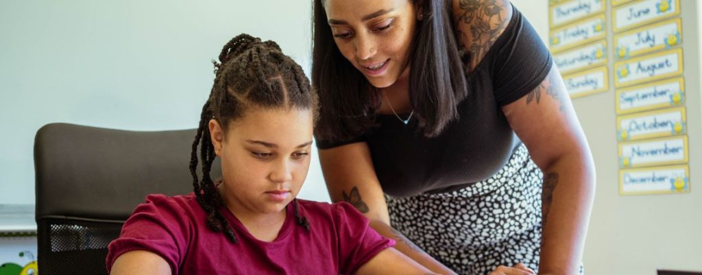A child and parent, before a parent-teacher meeting