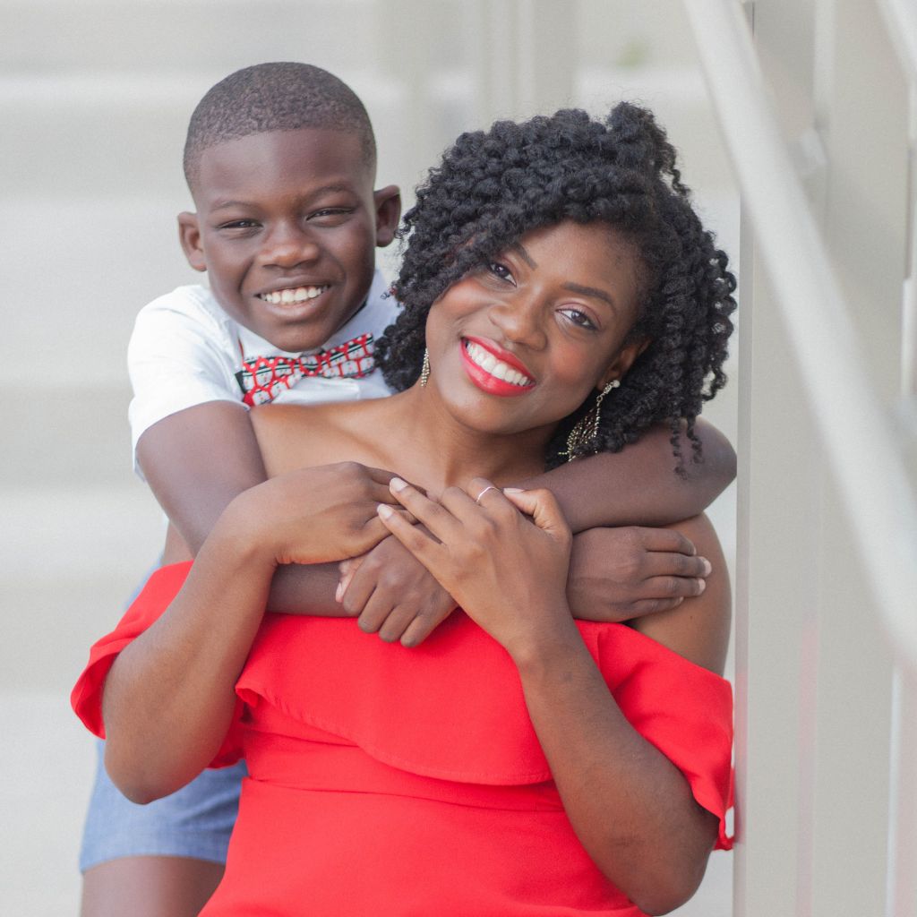 Joyful son embracing his smiling mother as she supports him to combat bullying.