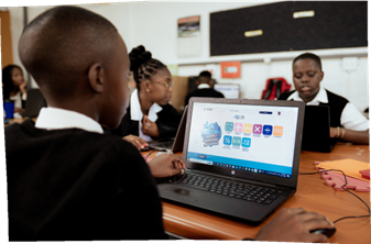 A learner using a laptop with iRainbow's software at school.