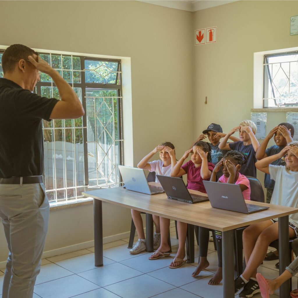 A teacher helping children who struggle with ADHD