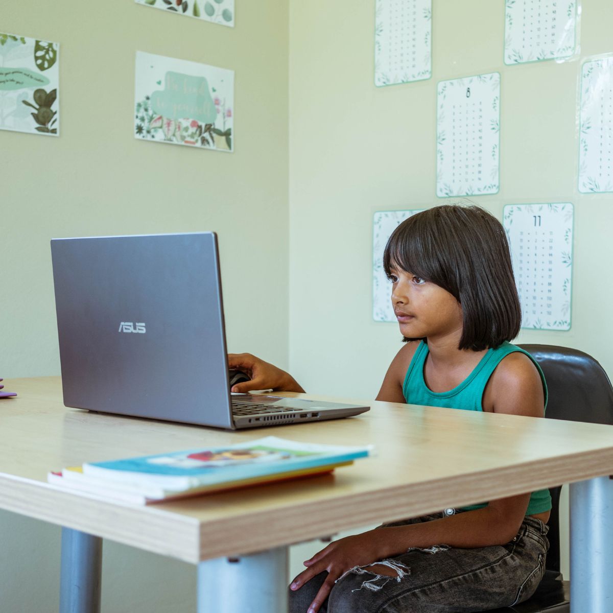 A learner using a laptop to learn grade 2 English