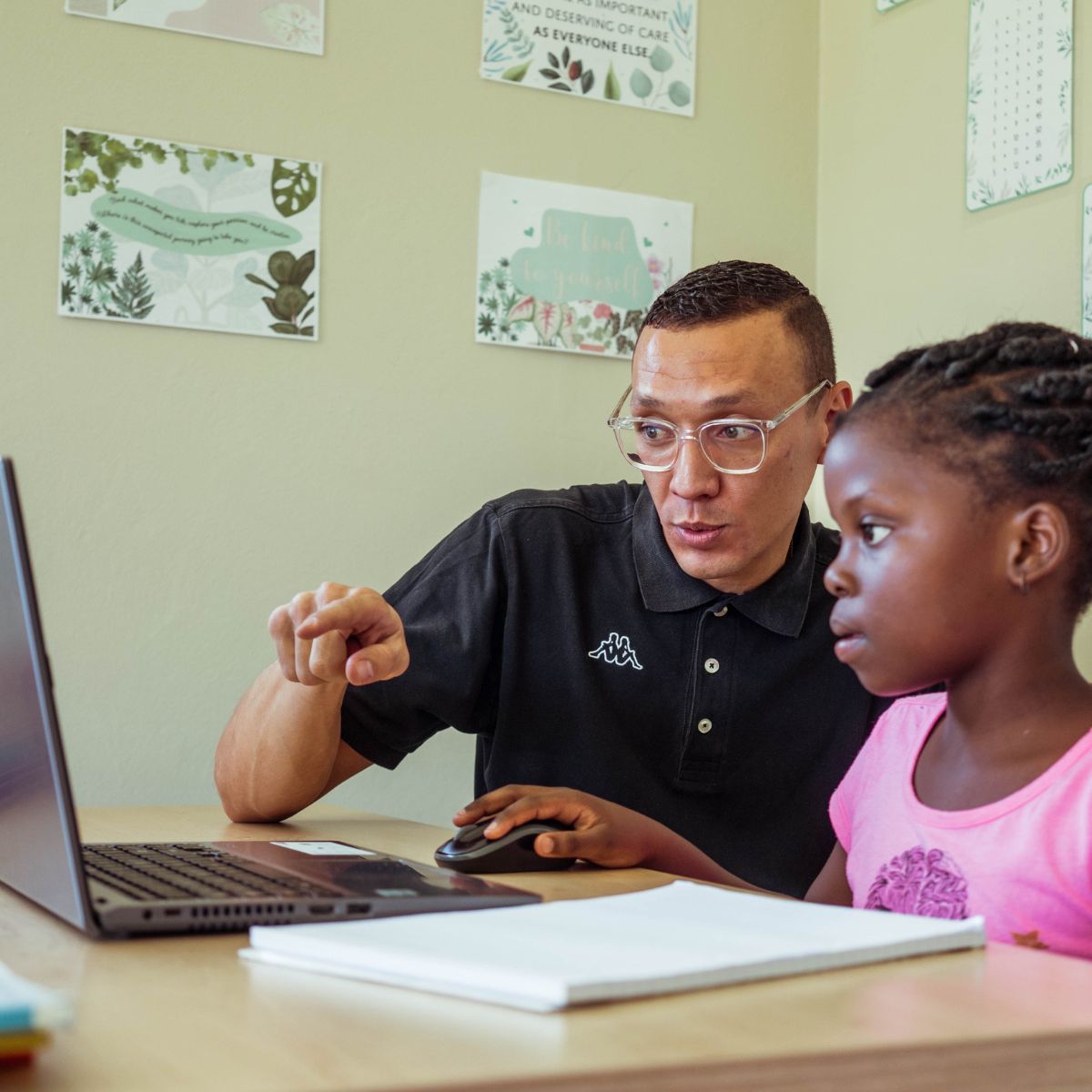 A learner using a laptop to learn Grade 4 English with iRainbow’s educational software.
