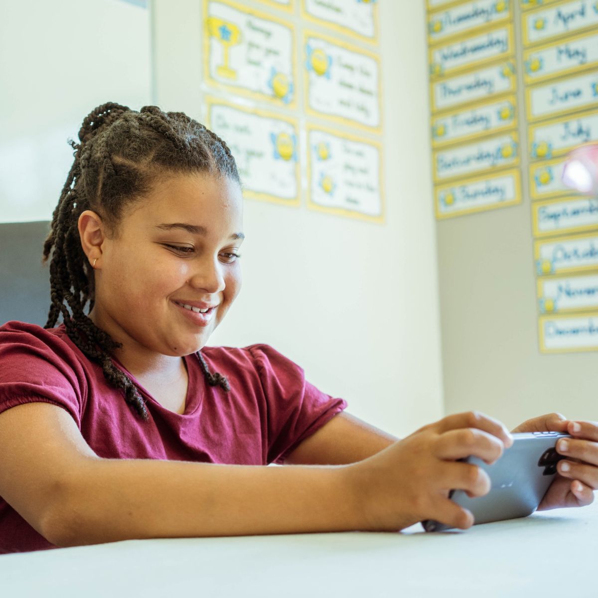 A learner using a phone to learn grade 3 English
